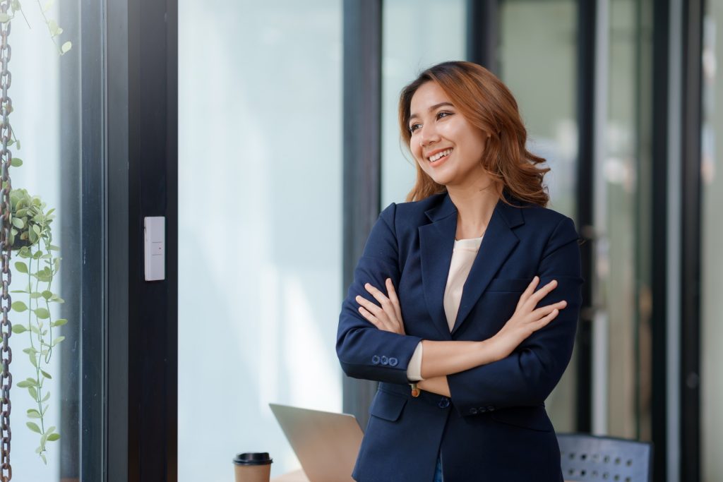 Confident regulatory growth consultant standing in professional office environment