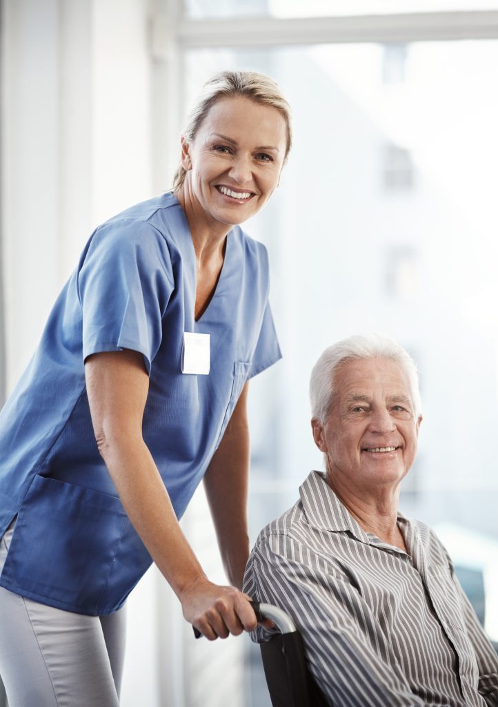 Compassionate caregiver providing personal care support to elderly senior in home care setting