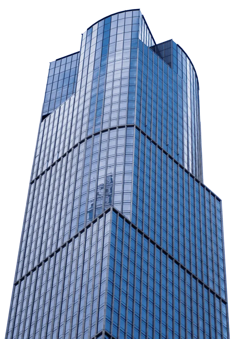 Tall modern skyscraper with blue-tinted glass windows and a multi-faceted design, viewed from below against a blank background.