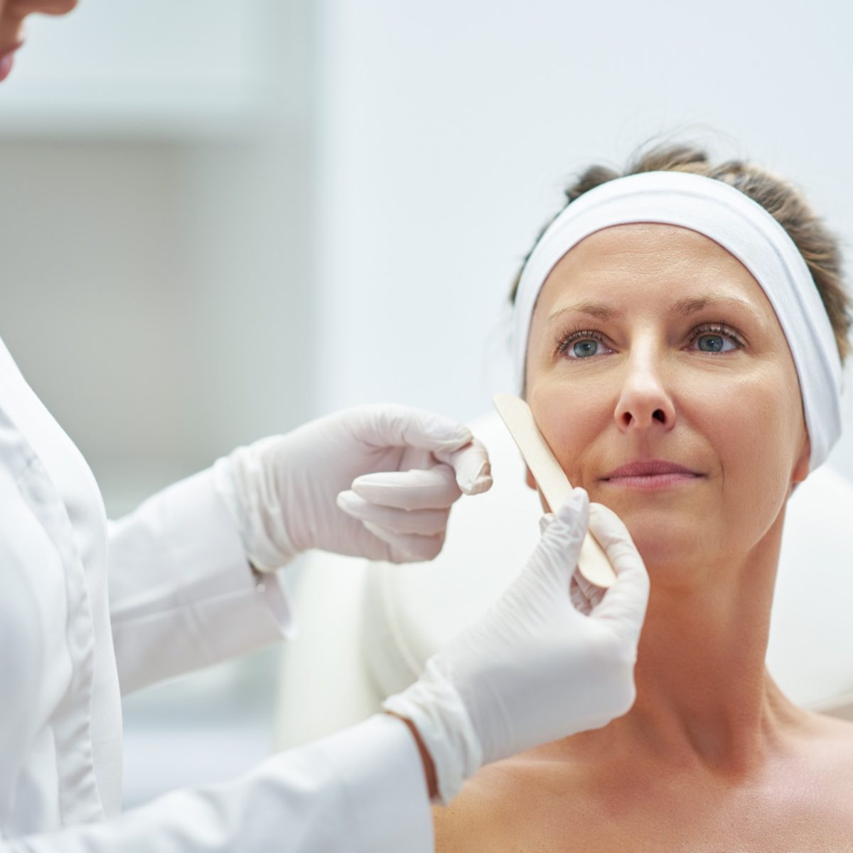 Medical cosmetology treatment being performed in a modern cosmetic clinic