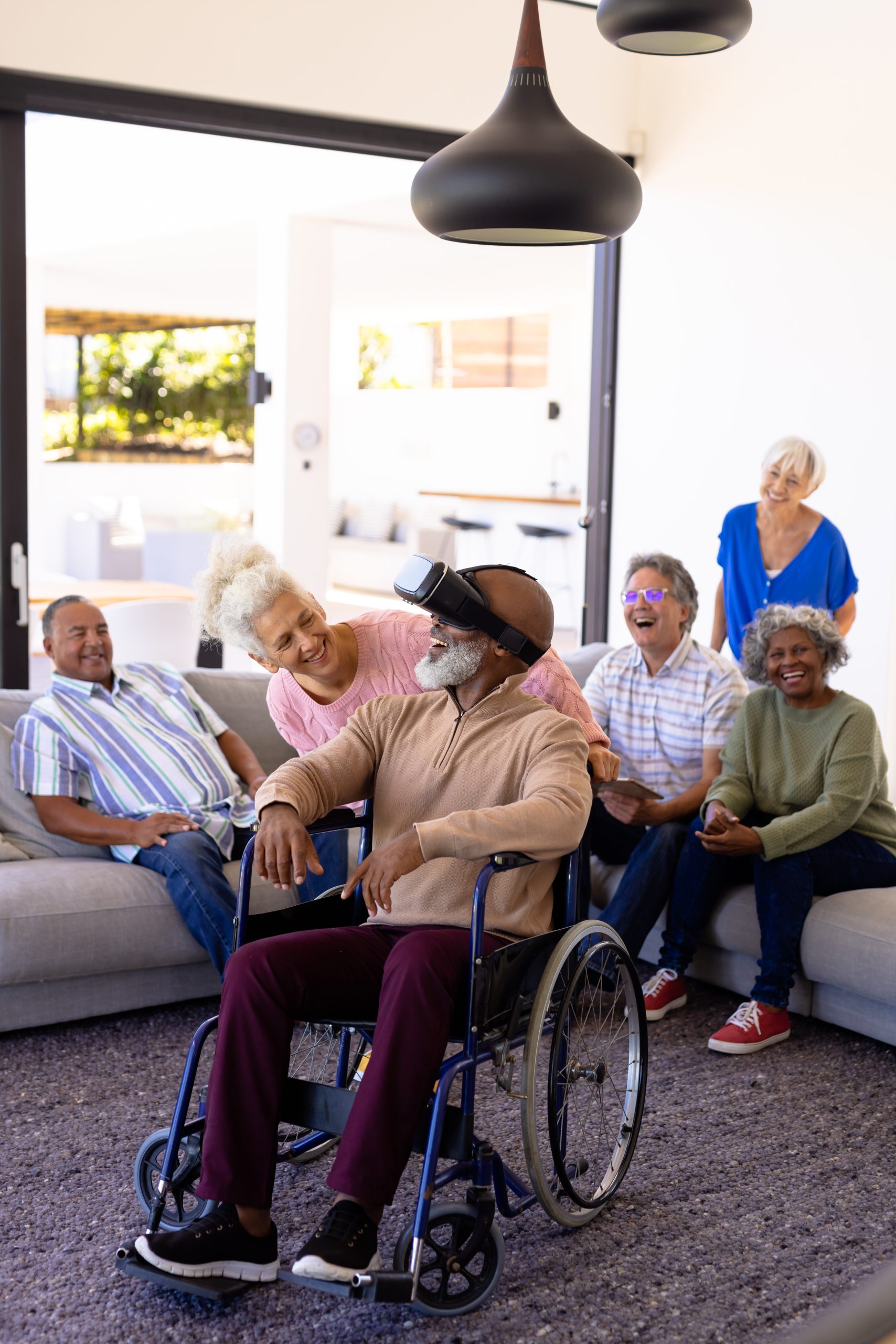 Happy multiracial seniors smiling and looking at a friend together