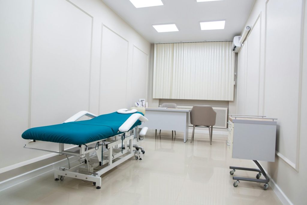 Modern cosmetic injectables clinic interior with contemporary medical office furnishings and treatment bed