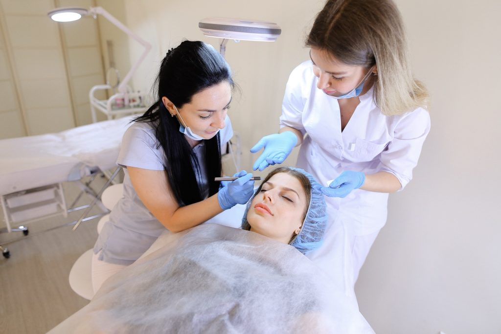Happy client visiting a professional cosmetic clinic for treatment consultation