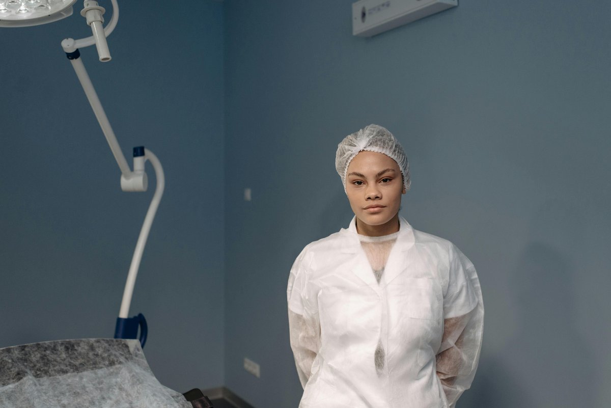 Confident female medical professional in a modern clinic room representing nurse injector entrepreneurship
