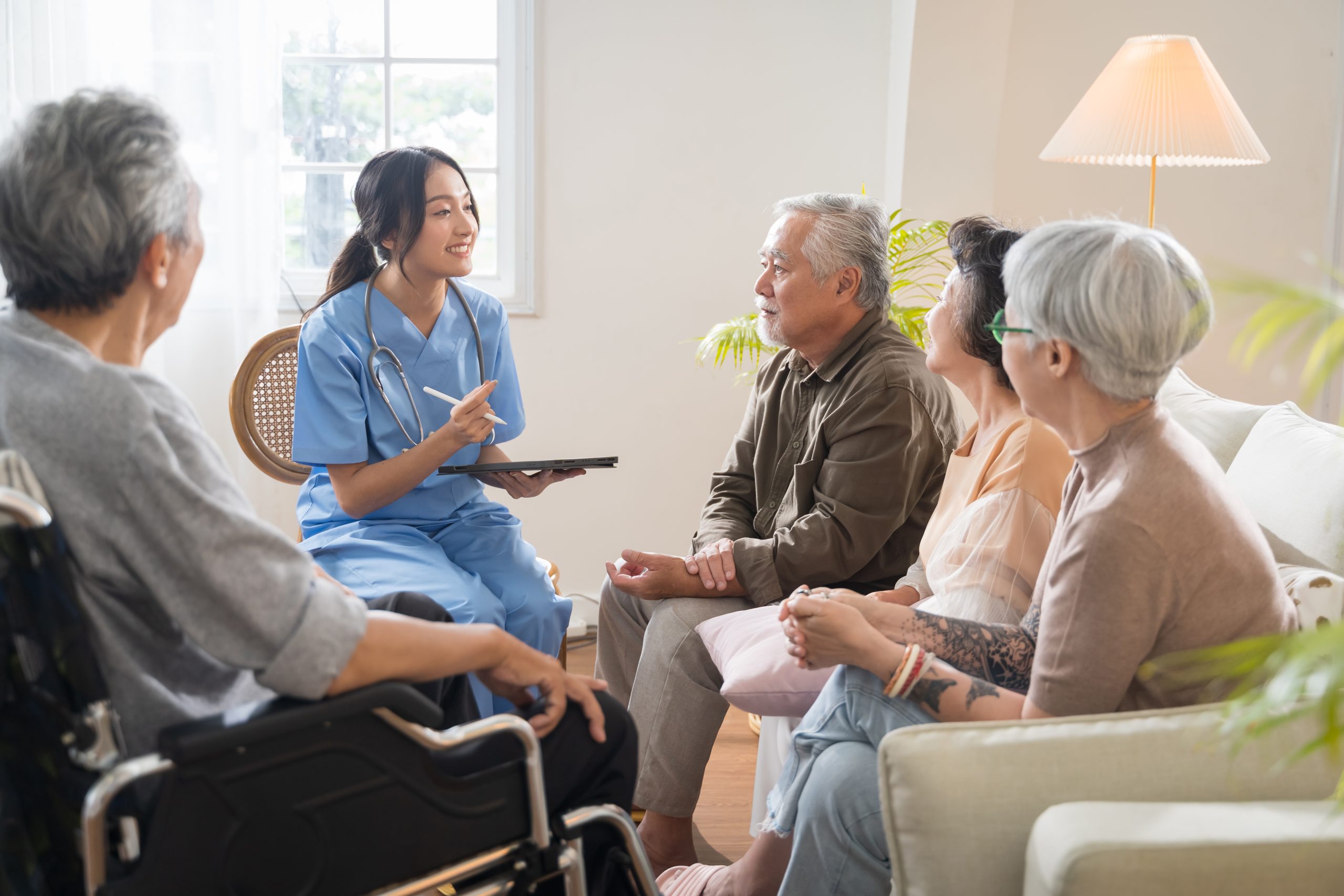 Group of elderly seniors participating in community activities at aged care facility