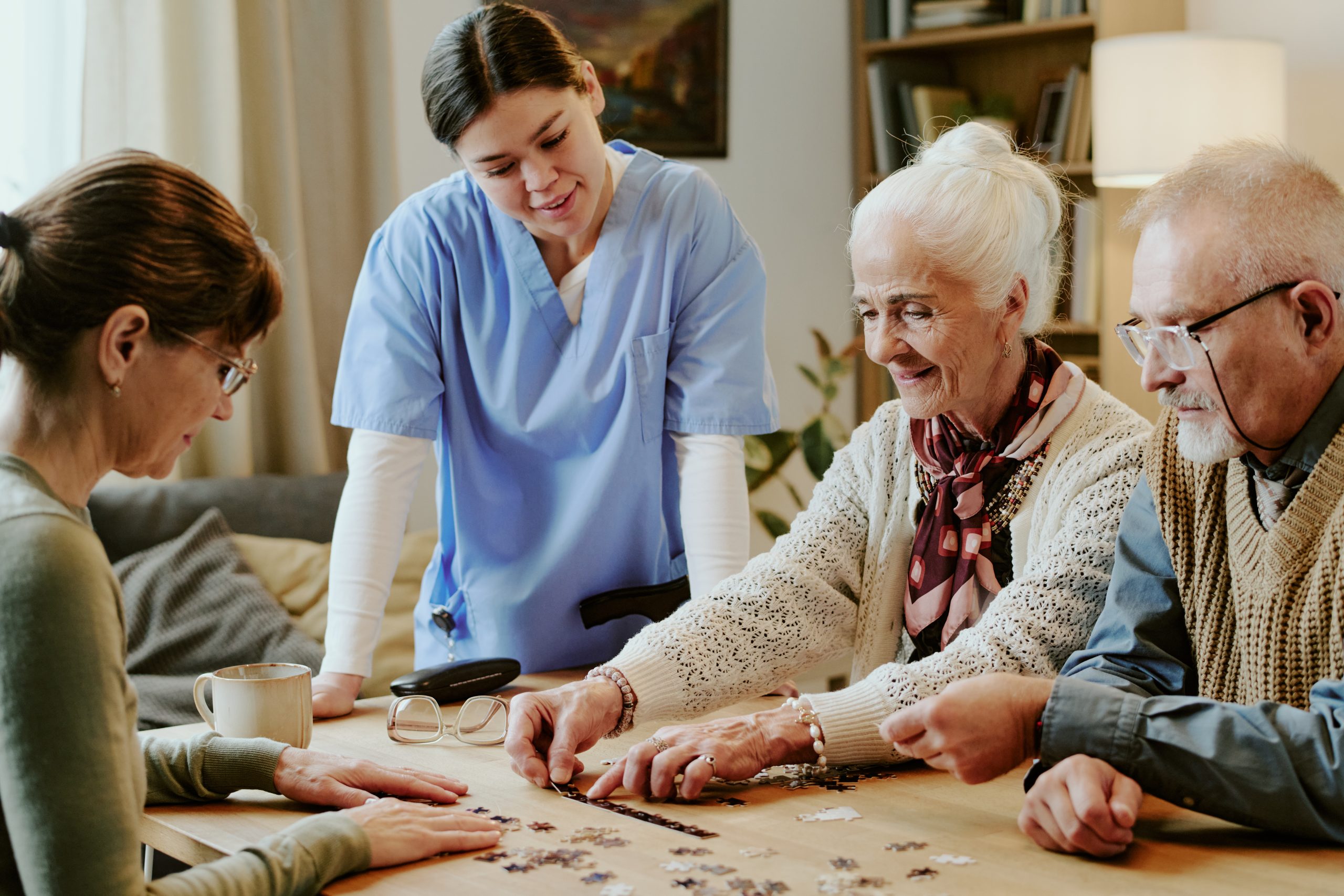 Elderly couple engaged in activities with nursing care support during aged care service