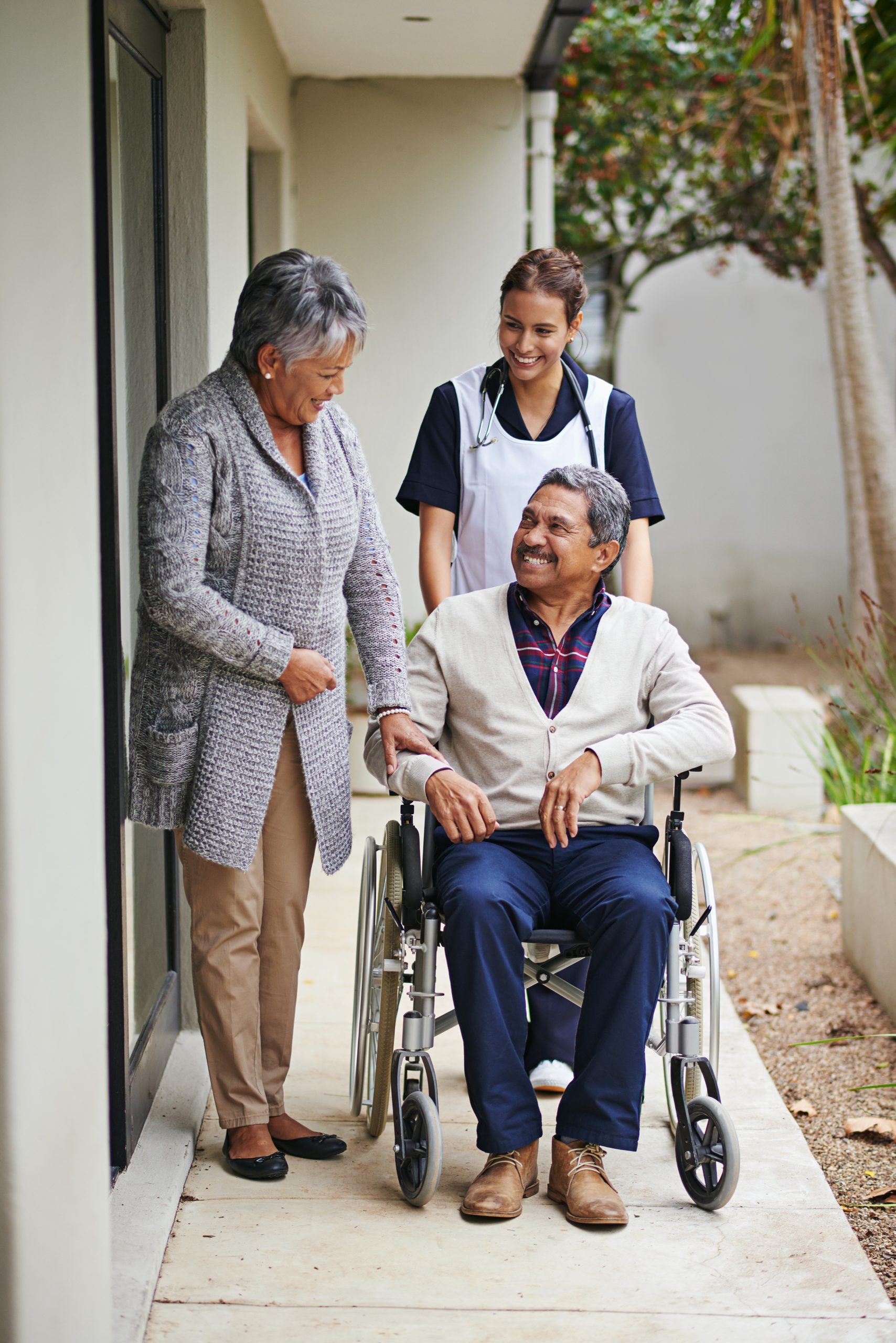 Elderly couple consulting with nursing professional for aged care support services