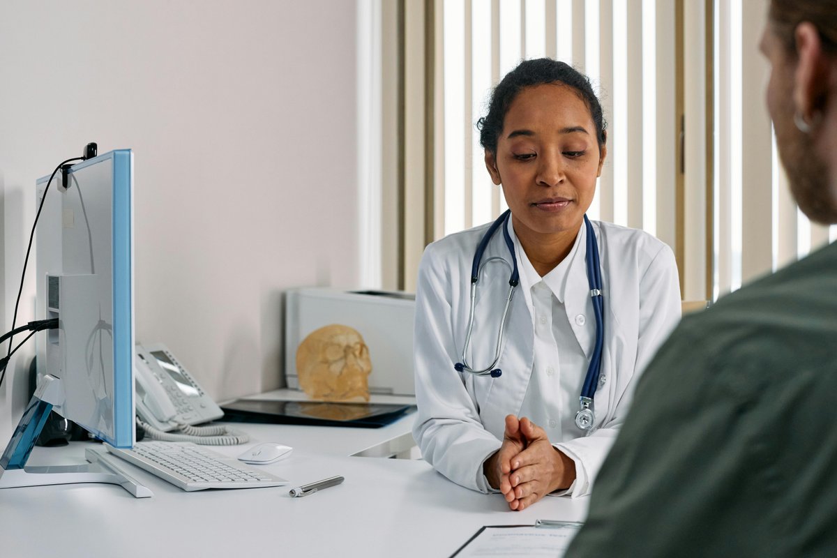 Doctor consulting with a patient in a modern weight loss clinic setting