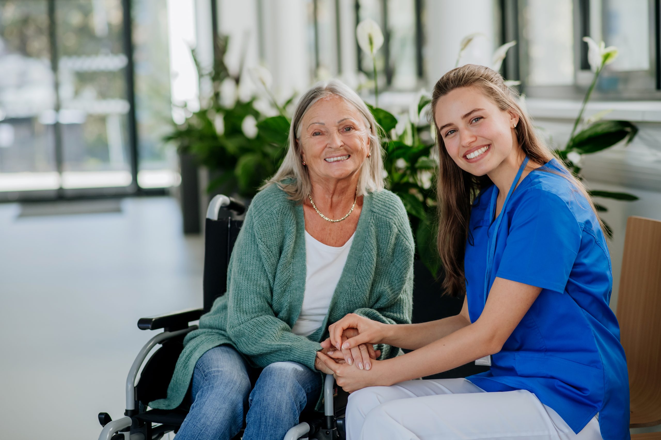 Female healthcare professional providing care to NDIS eligible participant