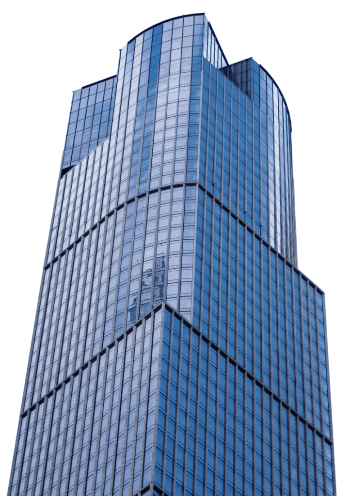 A modern high-rise building with blue-tinted glass windows and a geometric, multi-sectioned facade.